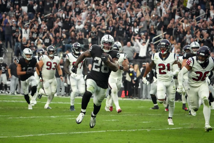 Las Vegas Raiders running back Josh Jacobs (28) scores on a 15-yard touchdown run in the fourth quarter against the Houston Texans. Mandatory Credit: Kirby Lee-USA TODAY Sports